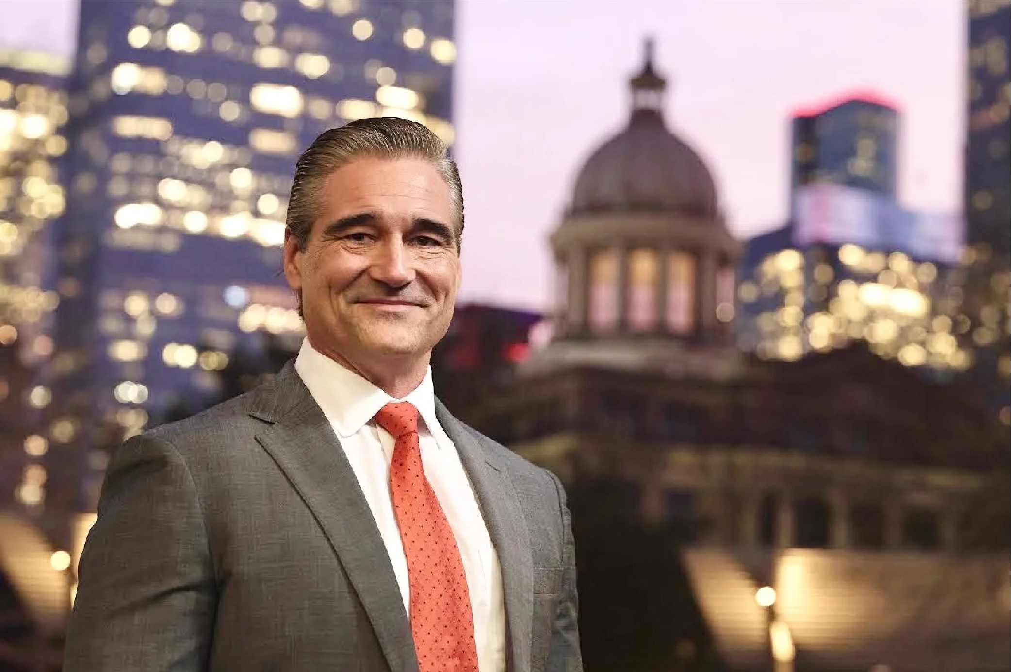 Sean Teare with  downtown Houston as the background